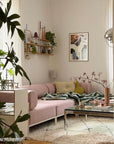 Luxury Wool Blanket featured in Modern living room with pink sofa, plants, and decorative items.