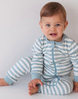 Baby wearing Woolbabe Pyjama Zip Suit for safe sleep and easy Nappy changes