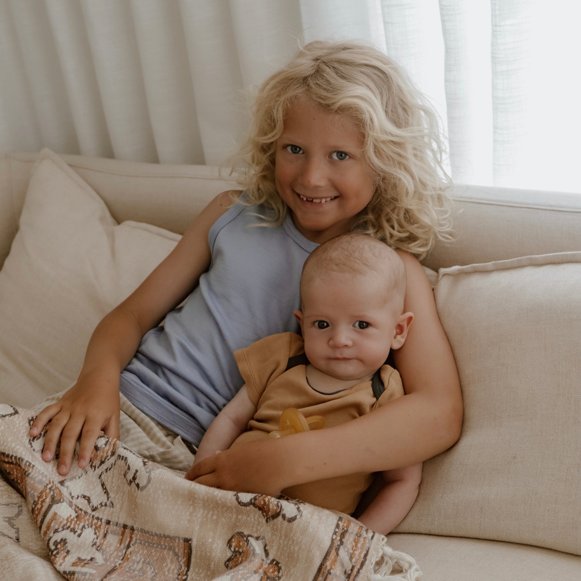 Children’s Merino Clothing Singlet and Bodysuit worn by siblings during a family photoshoot