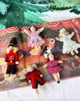 Puppet theater with puppets in front of a scenic backdrop