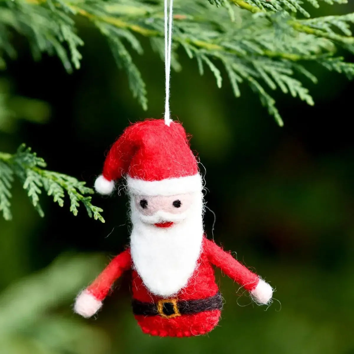 Felt Santa Claus ornament hanging on a Christmas tree